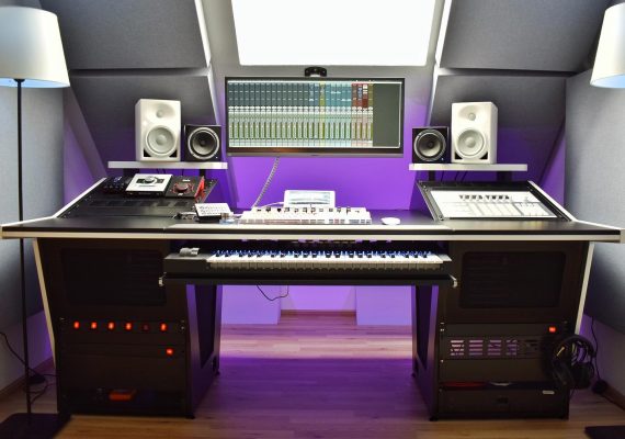 Front view of Dope Sound Studio with a white V3 Acoustic 56RU Desk, upper shelves and two monitoring systems.