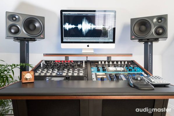 Front view of Audiomaster Ltd. with a V3 Acoustic 52RU Desk in figured sipo wood and the main monitoring system.